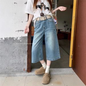 Real shot of American retro high street denim trousers for women in summer high waist ripped wide-leg trousers